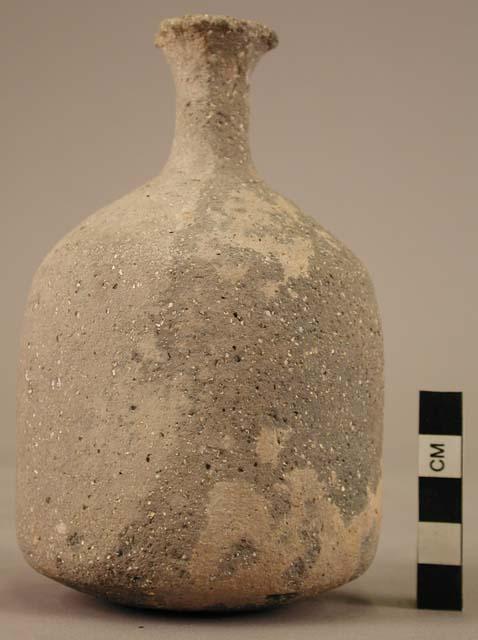 Pottery juglet - straight-sided body; flatly rounded bottom;