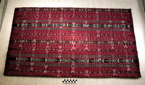 Double ikat patterned cloth of red, blue and white cotton; double ikat (jaspe) t