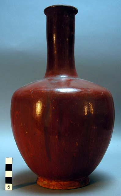 Long-necked red pottery vase with stopper