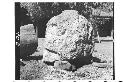 Fragmentary monumental stone sculpture of scoriaceous rock