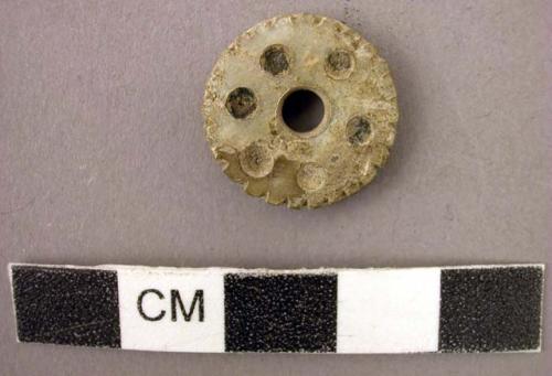 Cut shell disc - pierced, inlayed, with concave edge; child's earspool?