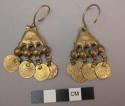 Pair of brass earrings with coin dangle