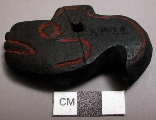 Stone pendant charm for scratching: argillite, with fish motif and red pigment