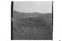 Man standing next to north side of Structure 1