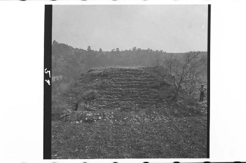 Man standing next to north side of Structure 1