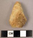 Small quartzite pointed flake implement worked on lower surface