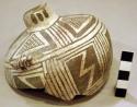 Part of small bottle, geometric design, with small animal handle