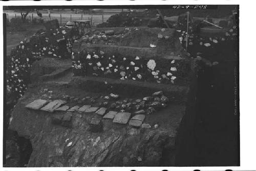 Mound B; Structure E. Broken cornice slabs and fill of shrine platform