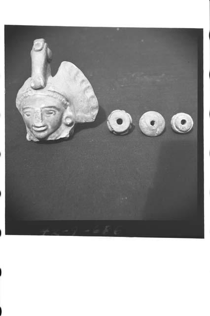 Pottery figurine head and 3 spindle whorls