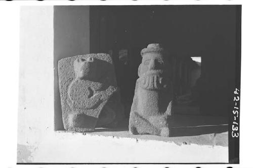 Stone metate with frog on underside and Tlaloc figure