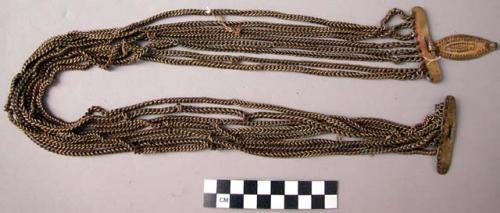 Chain girdle worn over 37-98-70/806 by chief's wife on feast days