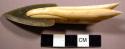 Harpoon head, ivory, greenstone. Incised grooves above and below line hole.