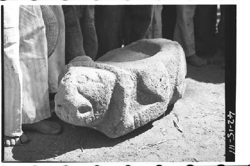 Crouching stone jaguar with depressions on top