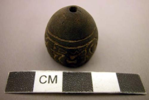 Lignite ornaments - hollow, cone-shaped, with carved bird and animal +