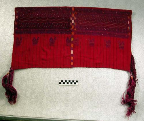 Small head covering; square with 4 purple tassles; red with purple, orange and w
