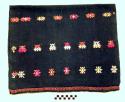 Tzute. navy with purple, yellow, white, and green embroidery. 49 x 83 cm.