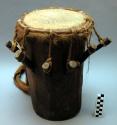 Large cylindrical wooden drum with skin top; woven carrying strap and +