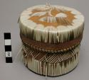 Small birch bark box with porcupine quill decoration.