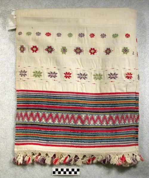 Large servilleta. white with embroidery in green, purple, yellow, and red. 132 x