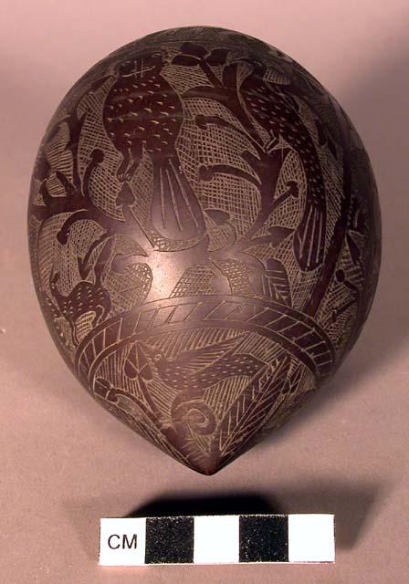 Gourd ornamented with carvings