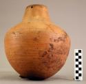 Jar, pottery, with 4 holes in lip for carrying twine