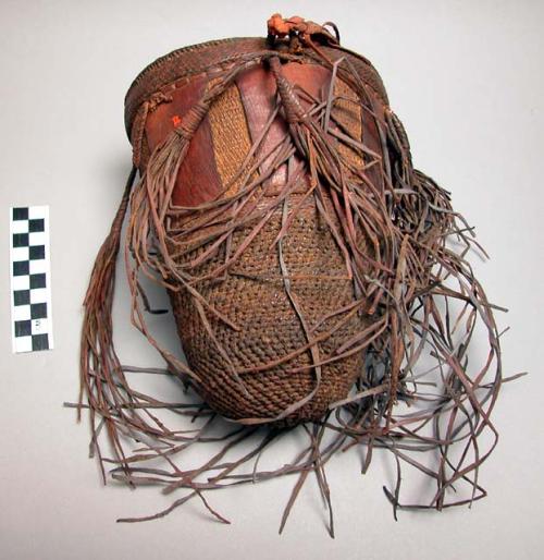 Basket decorated with leather