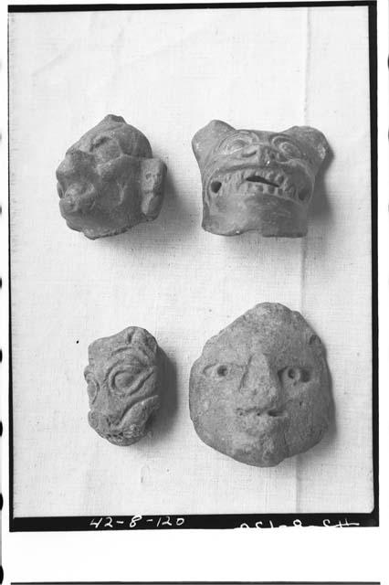 Four pottery heads