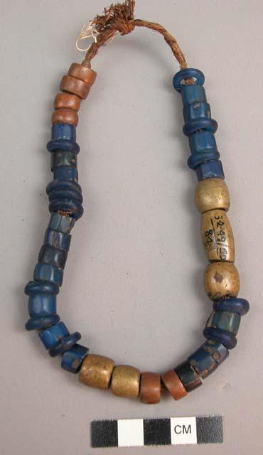 String of brass, copper and glass beads