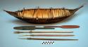 Model of canoe with 2 paddles and 3 spears