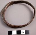 Spiral, chased iron bracelet with knob
