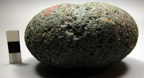 Medium-sized grooved ovoid stone sinker (mahe)