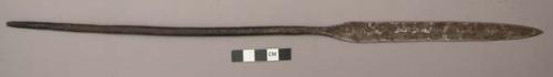 Spear point, ovate iron blade, long cylindrical stem, tapered end