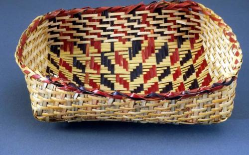 Basketry tray with interior design apctoin kastpy or broken weave.