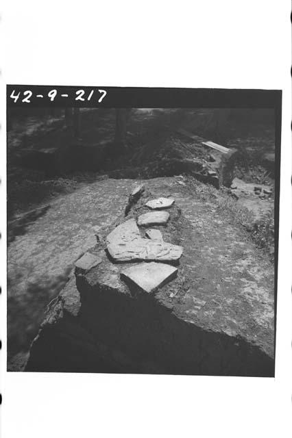 Flagstone paving with reused carved stone in situ