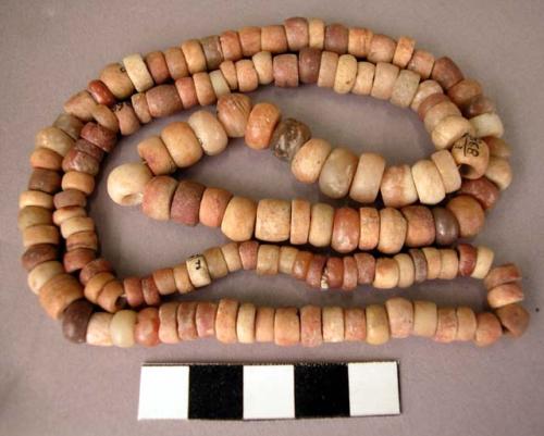 Small, discoidal, carnelian beads (2 bottles)