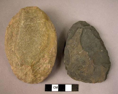 2 flat, oval chipped stone celts made from pebbles