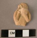 Figurine fragment; clay; torso and part of head.