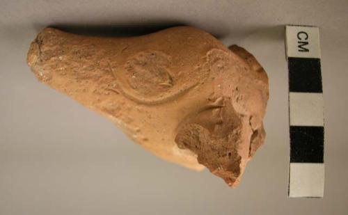 Figurine fragment; clay; jackal head.