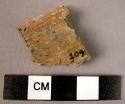 Taupe slipped rim sherd