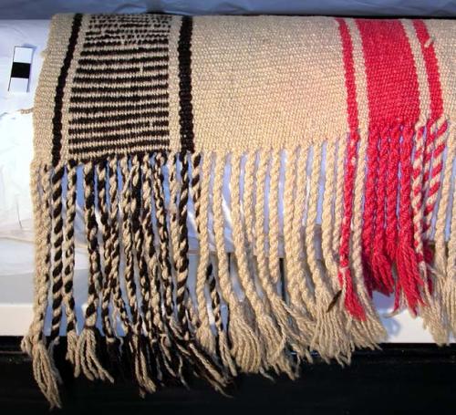 Wool poncho, white ground, vertical stripes in faded red and vertical bands of g