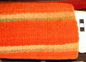 Banded saddle blanket or rug. Orange, green with neutral and green stripes