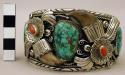 Cuff bracelet, silver band with floral motifs, set with stones and bear claws
