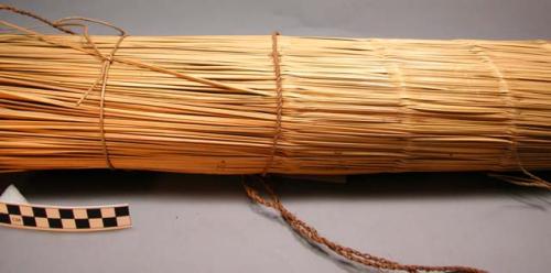 Mat of river reeds - used generally as sleeping mat, also as curtain, etc.