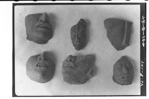 Six pottery heads