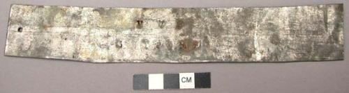 Tag for enslaved person, tin; initials of enslaver and point of destination.