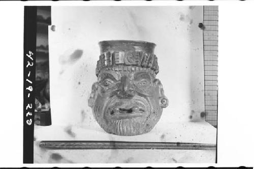 Plumbate human head jar, Old man