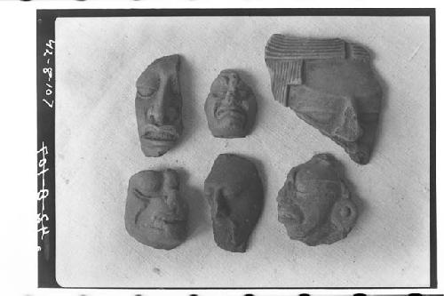 Six pottery heads