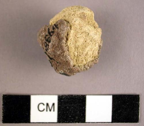 Lump of yellow ochre with sandstone adhering to portion