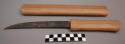 Iron knife with carved wooden handle and sheath
