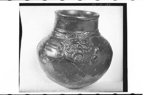 Plumbate standar jar with appliqued human head;